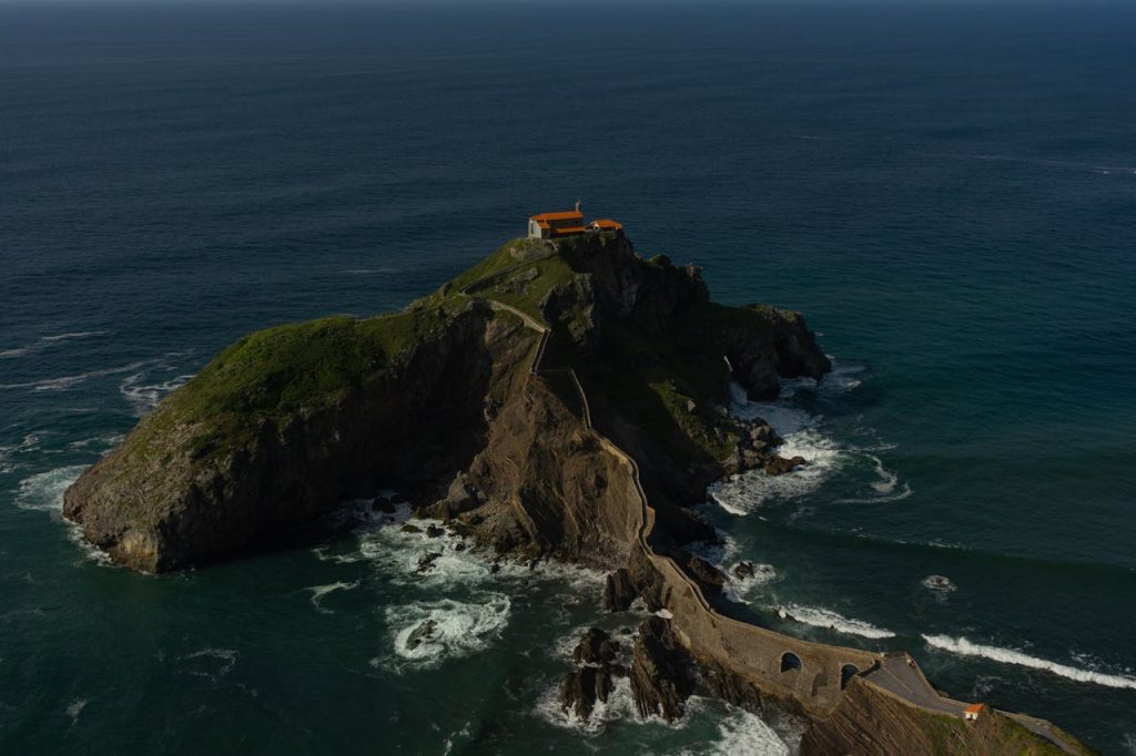 Stunning aerial view of San Juan de Gaztelugatxe, a dramatic island in Spain with a hermitage atop.